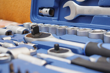 Close-up wrenches in a tool case. Chrome plated wrenches. Wrenches of different sizes and types.