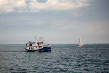 Fototapeta na wymiar Moody Boat Sailing on Lake