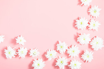 Obraz na płótnie Canvas Beautiful flowers composition. White flowers on pastel pink background. Flat lay, top view, copy space