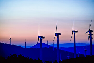 wind turbines at sunset