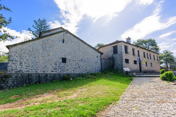 Paved road and buildings of the Monastery of Agios Nikolaos of Philanthropenoi on Ioannina Island.The Monastery was built at the end of the 13th century.