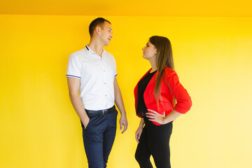 A girl and a guy on a yellow background.