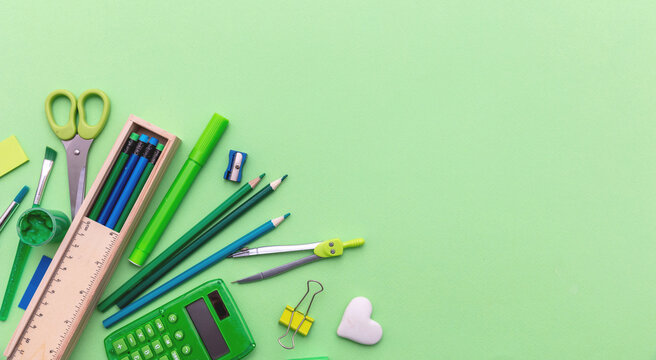 School supplies on green color background, top view, copy space