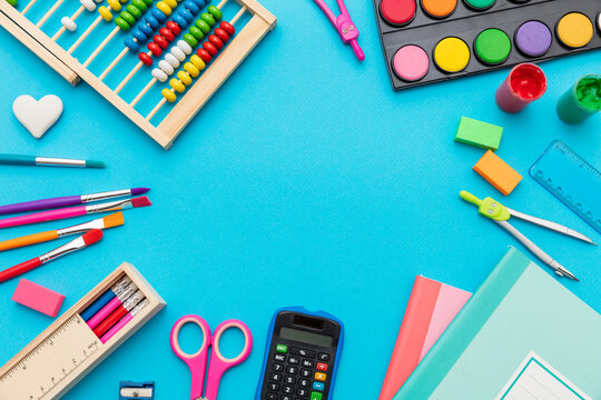School supplies on blue color background, top view, copy space