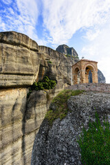 Chapel on top of a mountain in the Holy Monastery of Saint Nicholas Anapafsas at Meteora against the backdrop of the amazing mountain formations of Meteora, Greece