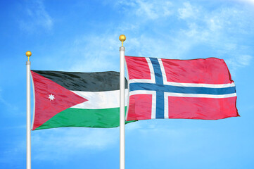 Jordan and Norway two flags on flagpoles and blue cloudy sky