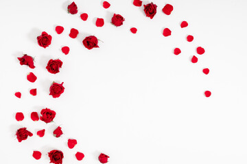 Beautiful flowers minimal composition. Red rose, rose petals on white background. Valentine's Day, Happy Women's Day, 8 March, Flat lay, top view, copy space