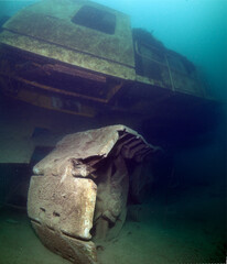 Excavator wreck in a fresh water lake. © frantisek hojdysz