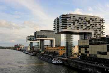 The entire riverside of the Rhine river is lined with new modern buildings in Cologne, Germany.