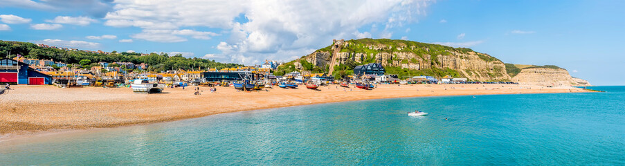 A panorama view of the fishing quarter and east cliffs in Hastings, Sussex in summer