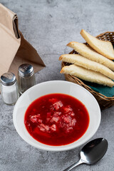 Russian beetroot soup borscht in a white bowl in a russian restaurant