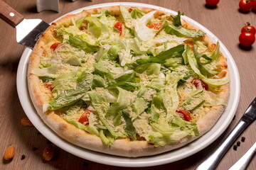 Caesar pizza thin cake Caesar sauce, chicken fillet, parmesan, iceberg