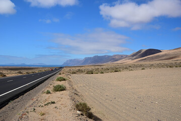 Tar road between volcanic landscape. Lanzarote. Spain