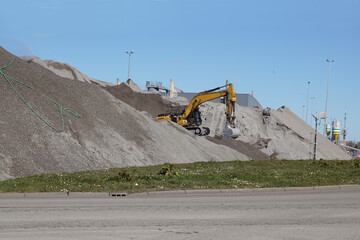 Piles of bottom ash from the waste recycling factory has been cleaned, metals are removed and what is left is used in construction instead of sand. Elevators. Alkmaar, Netherlands, March 