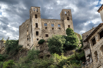 Fototapeta na wymiar The ancient hilltop castle of Dolceacqua, Italy, in the Imperia Ligurian region, on an overcast day.