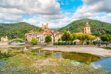 Fototapeta na wymiar The medieval village of Dolceacqua, Italy, showing the San Fillipo Church, hilltop Castello castle, arched Monet bridge, and the ancient cathedral.