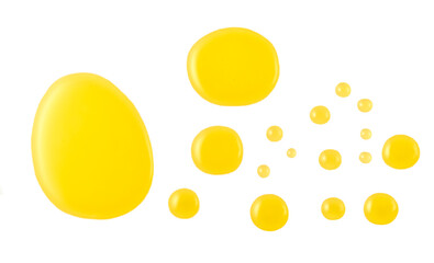 different sizes of drops of honey isolated on white background. Top view.