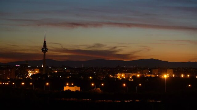 Madrid landscape during beautiful sunset with Tv tower and buildings, static shot