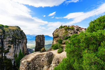 Fototapeta na wymiar View of the stunning rock formations of Meteora and Holy Monastery of the Transfiguration (Metamorphosis) of Christ (Great-Meteoron)