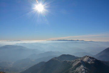 A view over mountains in a cold winter day