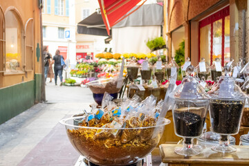 Wrapped spices, teas, fragrances and ingredients outside the patio of a gift store in the Old Town center of Nice, France.