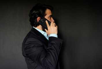 bearded businessman mid adult looking working on his smart phone