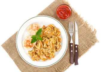Homemade soy cutlets, fried cabbage on plate.