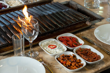 Different types of meat grilled on Barbecue on the table, Served with special Turkish appetizers and Turkish raki