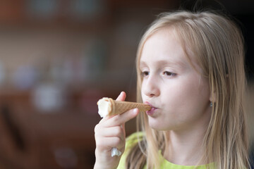 Pretty baby girl kid eating licking big ice cream