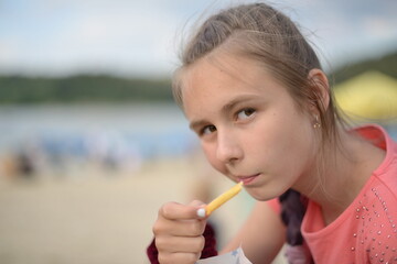 little girl eating chips
