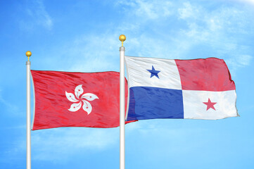 Hong Kong and Panama two flags on flagpoles and blue cloudy sky