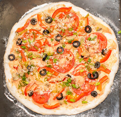 Home-made vegetarian pizza before baking