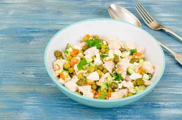 Mix salad with vegetables, meat and capers