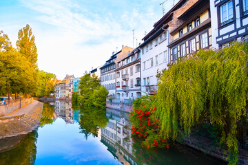 Fototapeta na wymiar Panoramic view of traditional half-timbered houses on canals in district little France in the medieval town of Strasbourg, Alsace, France.