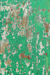 Peeling painted metal with rust and scratches. Vertical shot