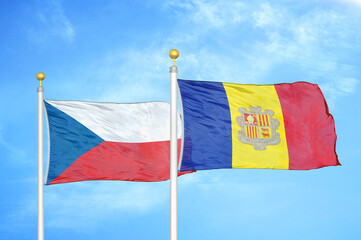 Czech and Andorra two flags on flagpoles and blue cloudy sky