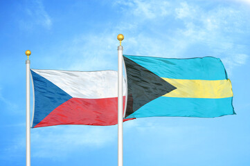 Czech and Bahamas two flags on flagpoles and blue cloudy sky