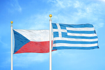 Czech and Greece two flags on flagpoles and blue cloudy sky