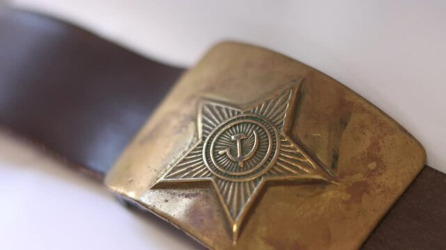 Old soldier's belt buckle with the symbols of the Soviet Union.