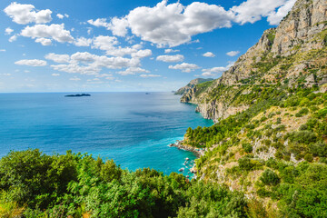 Fototapeta na wymiar A view from the famous Amalfi Coast drive road towards the cliffs, mountains, coastline, beaches and Mediterranean Sea near Sorrento, Italy
