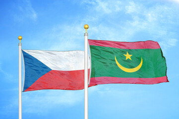 Naklejka na ściany i meble Czech and Mauritania two flags on flagpoles and blue cloudy sky