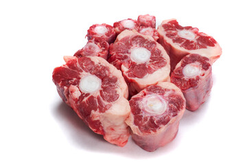 Fresh uncooked ox tail portions on white background. Meat industry product.