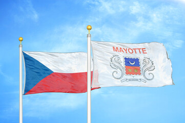 Czech and Mayotte two flags on flagpoles and blue cloudy sky