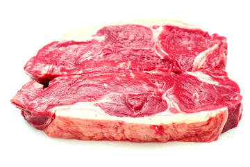 Two fresh strip loin steaks on a white isolated background. Meat industry product.