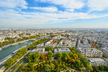 A view of the city of Paris, France including the river Seine from the platform of the Eiffel Tower on a partly cloudy afternoon