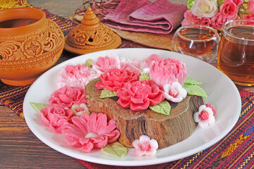 Obraz na płótnie Canvas Beautiful flowers shaped Coconut milk jelly, famous Thai dessert