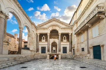 A unidentifiable Croatian woman walks through the Peristil or Peristyle Square of the ancient Diocletian's Palace in old town Split Croatia © Kirk Fisher