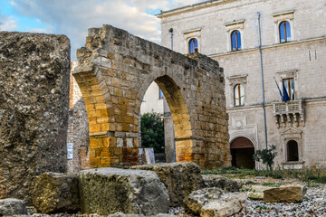 Ancient Roman ruins on Piazza Sotille de Falco outside the archaeological area of San Pietro degli Schiavoni in the Brindisi, Italy