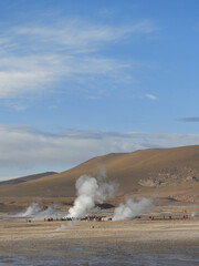 geyser in desert under the blue sky