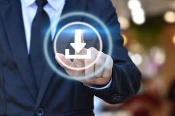 Businessman hand pushing web download icon on virtual touchscreen interface.